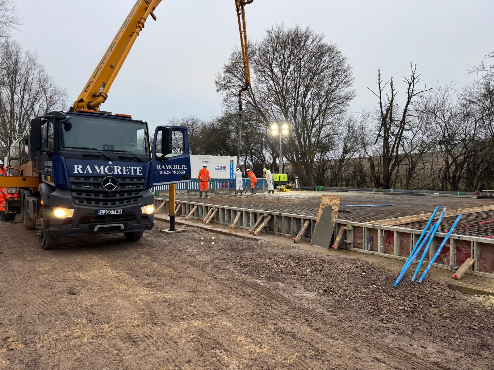 Concrete pump feeding a slab pour at Amersham, Tonbane Construction project near Old Vinyl Factory, Hayes UB3